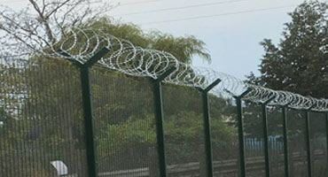 Barbed Wire Security Fence Topping Installation in Kent